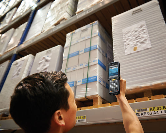 Zebra MC3300x rugged keypad mobile computer, pistol grip, 38-key function numeric keypad (MC330L-GE3EG4RW) – in use in a warehouse