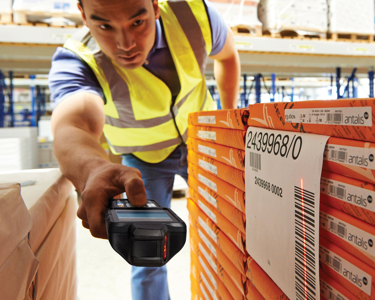 Zebra MC3300x rugged keypad mobile computer, rotating turret head, 29-key numeric keypad (MC330L-RL2EG4RW) – in use in a warehouse