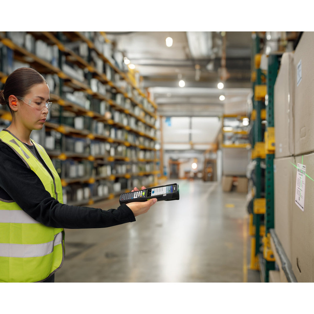 Zebra MC3400 rugged keypad mobile computer, straight shooter, 38-key function numeric keypad (MC3401-0S1M53SS-A6) – in use in a warehouse