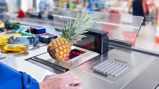Datalogic Magellan 9550i bi-optic in-counter scanner (957013101) – in use at a staffed checkout